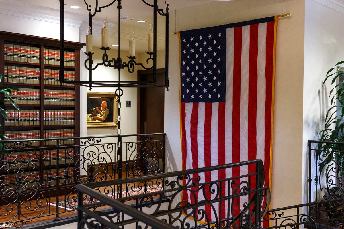 USA Flag at the top of the Beus O’Connor McGroder staircase